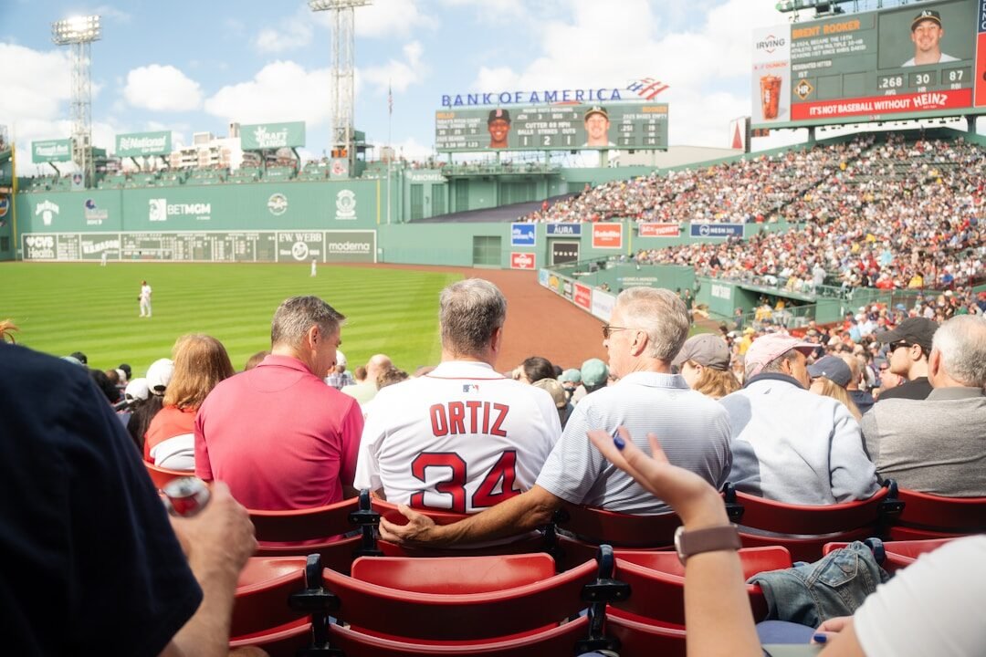 Spectators watch a baseball game at fenway park.