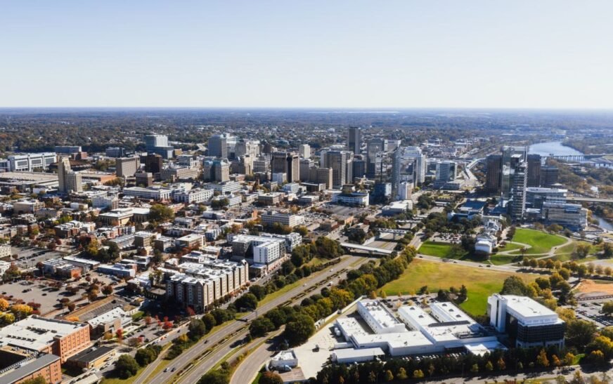 Aerial view of downtown Richmond, Virginia capturing the skyline and surroundings on a clear day.