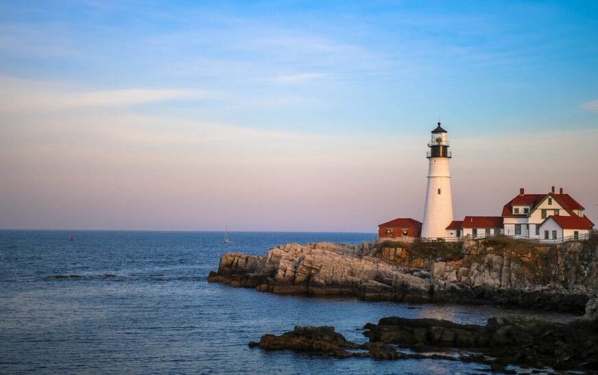 white lighthouse near body of water