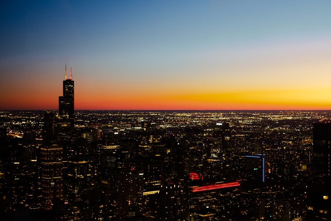 a view of a city at night from the top of a building