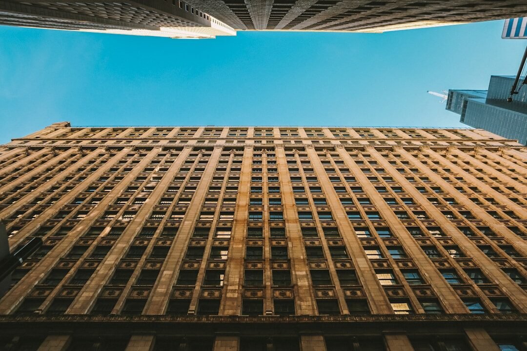 looking up at the top of a tall building