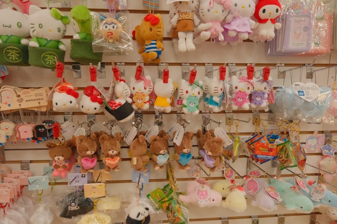 Assortment of cute plush toys and keychains on display.