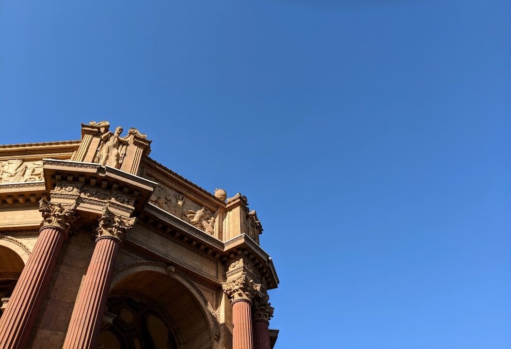 white concrete building under blue sky during daytime