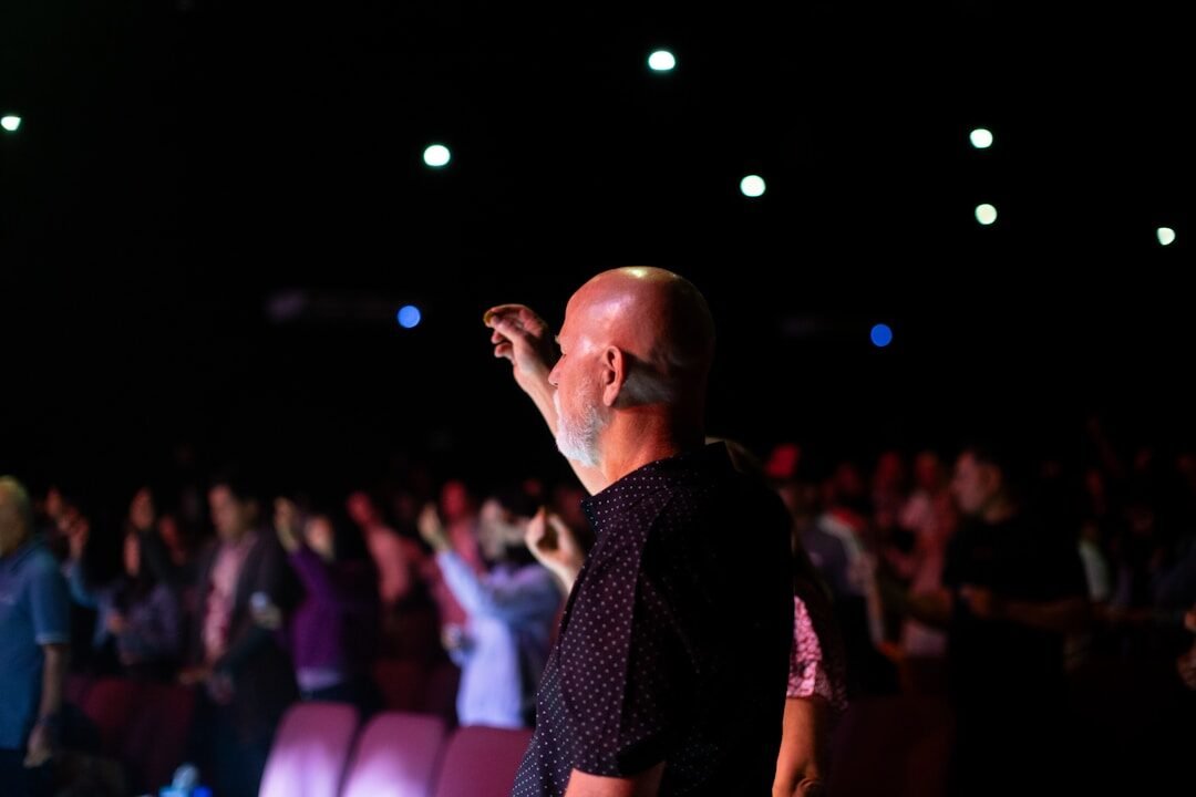 A man standing in front of a crowd of people