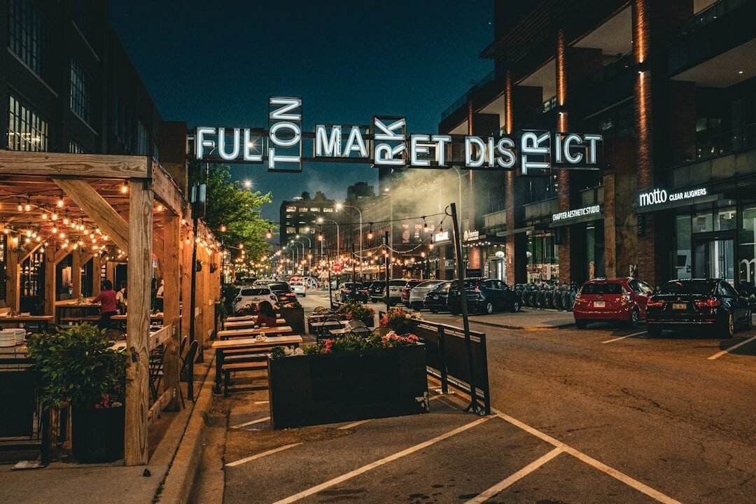 Fulton market district street scene with outdoor dining at night.