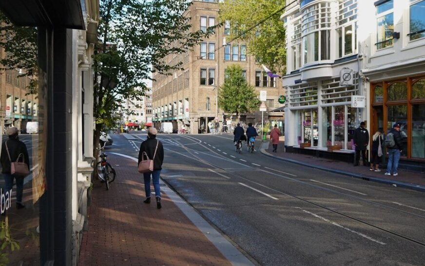a person walking down a street in a city