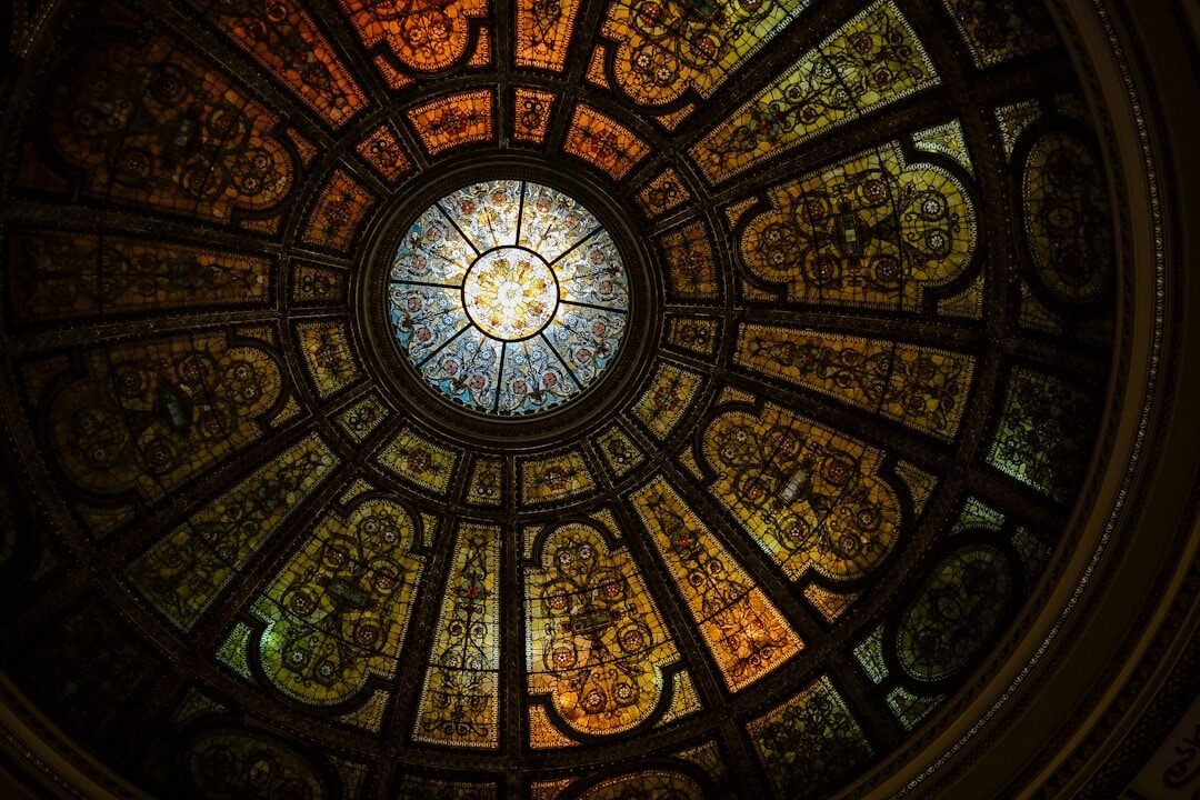 a circular stained glass window in a building