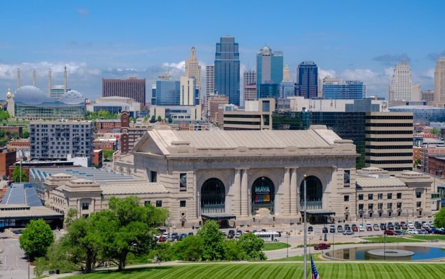 a large building with a pool in front of it with Union Station in the background