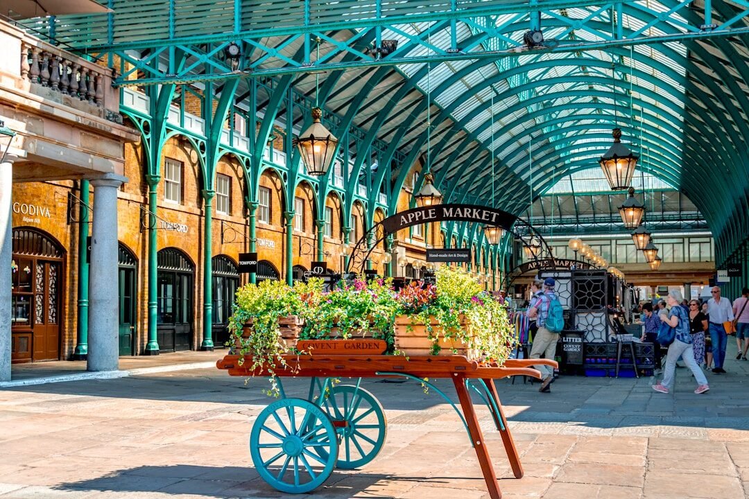 Cart with plants in a market under arched roof