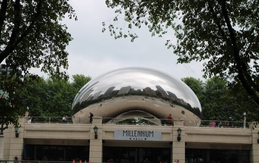 a large metal ball sitting on top of a building