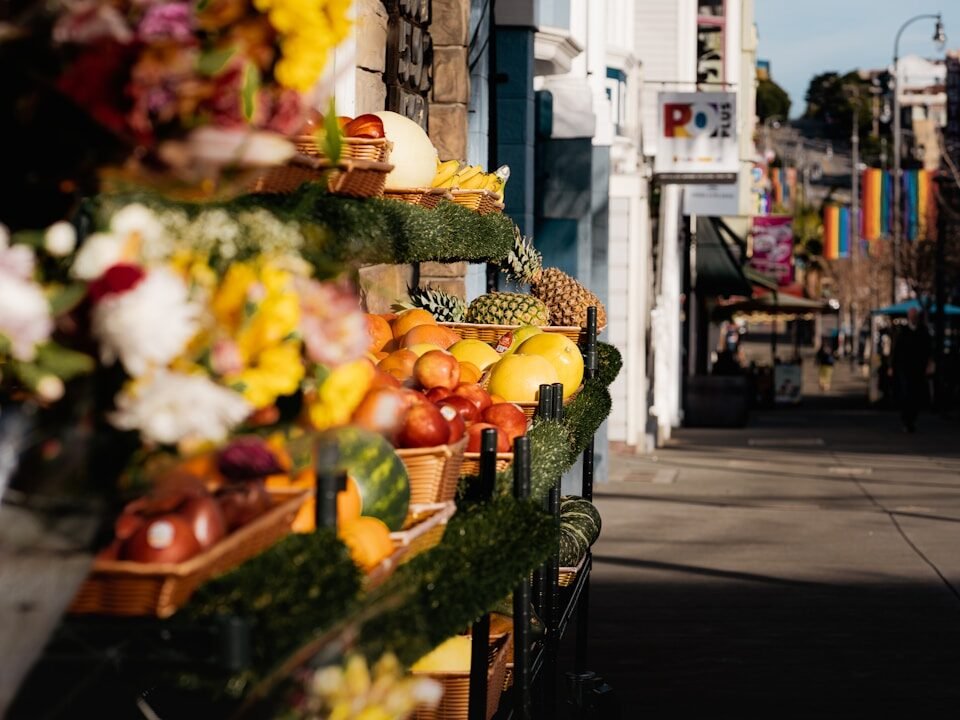 a bunch of fruits and vegetables are on display