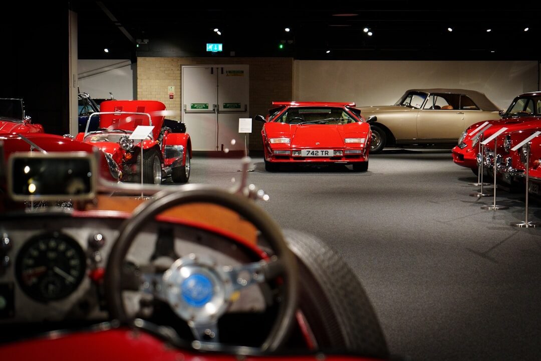 a group of cars parked next to each other in a garage