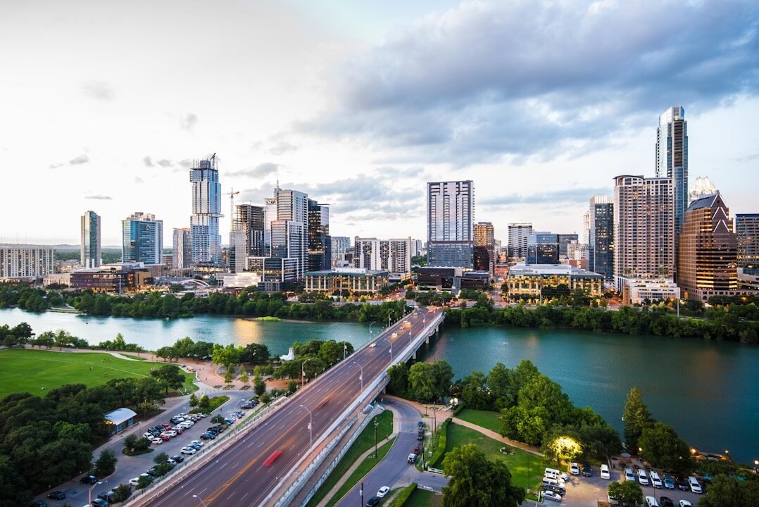 An aerial view of the Austin skyline and Congress Avenue Bridge over Lady Bird Lake