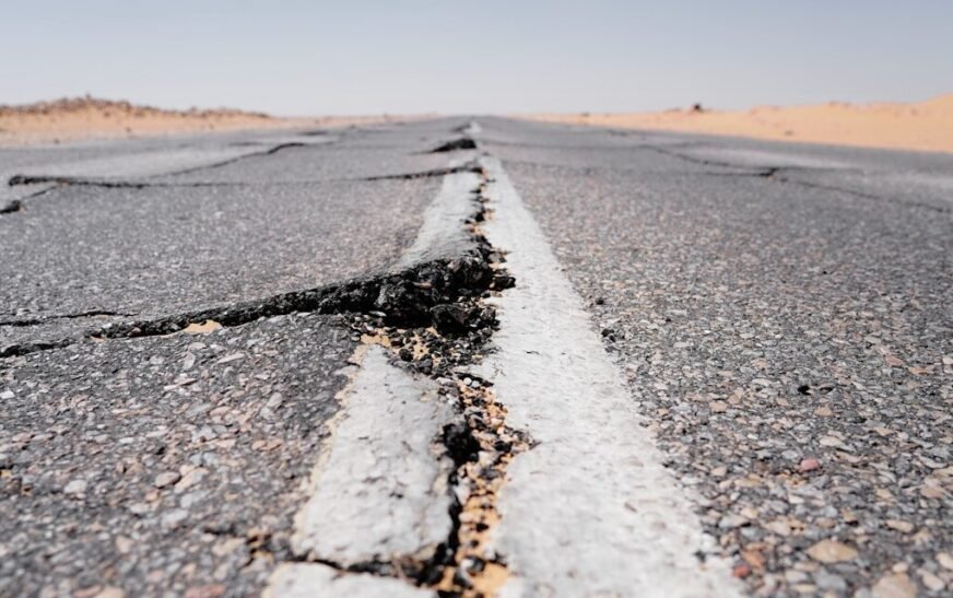 a crack in the middle of a road in the middle of nowhere