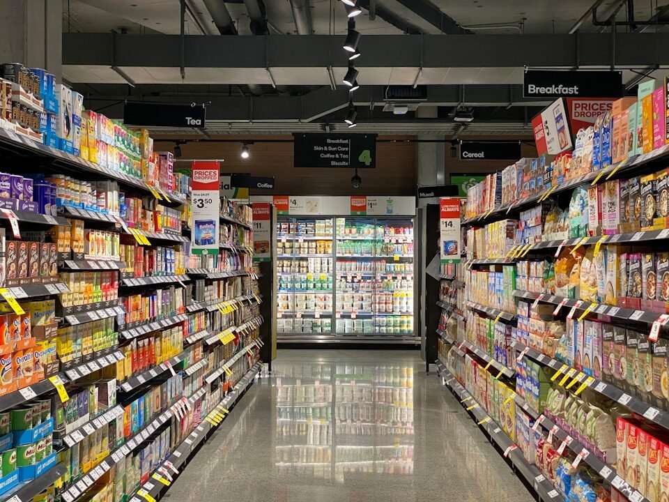 grocery store aisle with stocked shelves