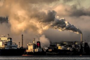 industrial harbor with smokestack pollution